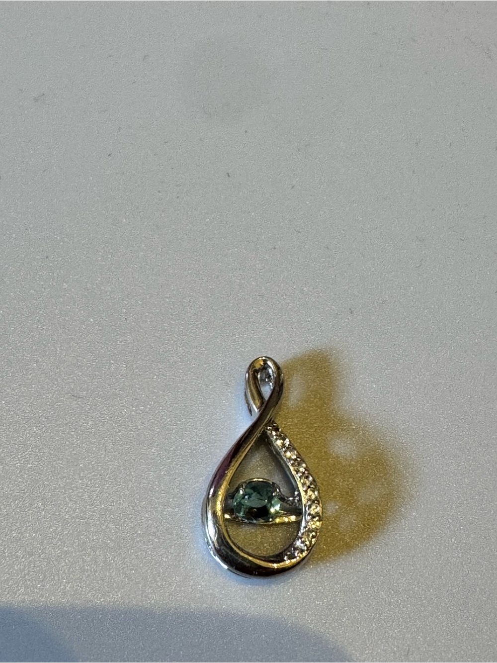 Sterling Silver Teardrop Pendant with blue Gem and Accent Stones. New no tag